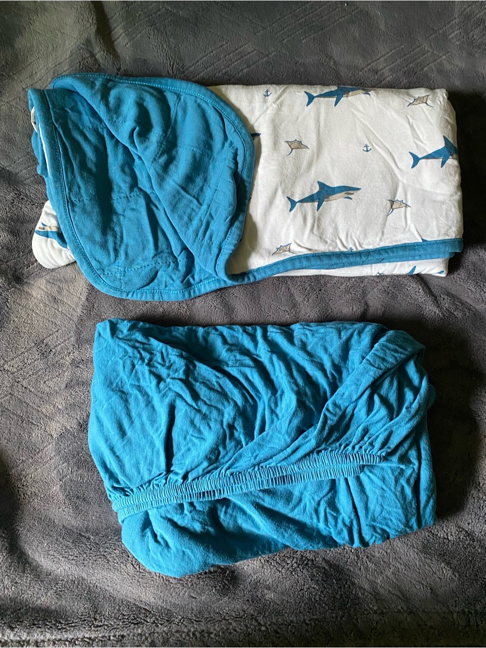 Kyte Baby blue crib sheets and shark blanket set.